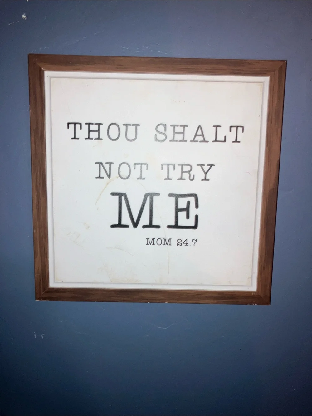 Source Unknown Framed Wall Art - Brown Frame, Black Text, White Background